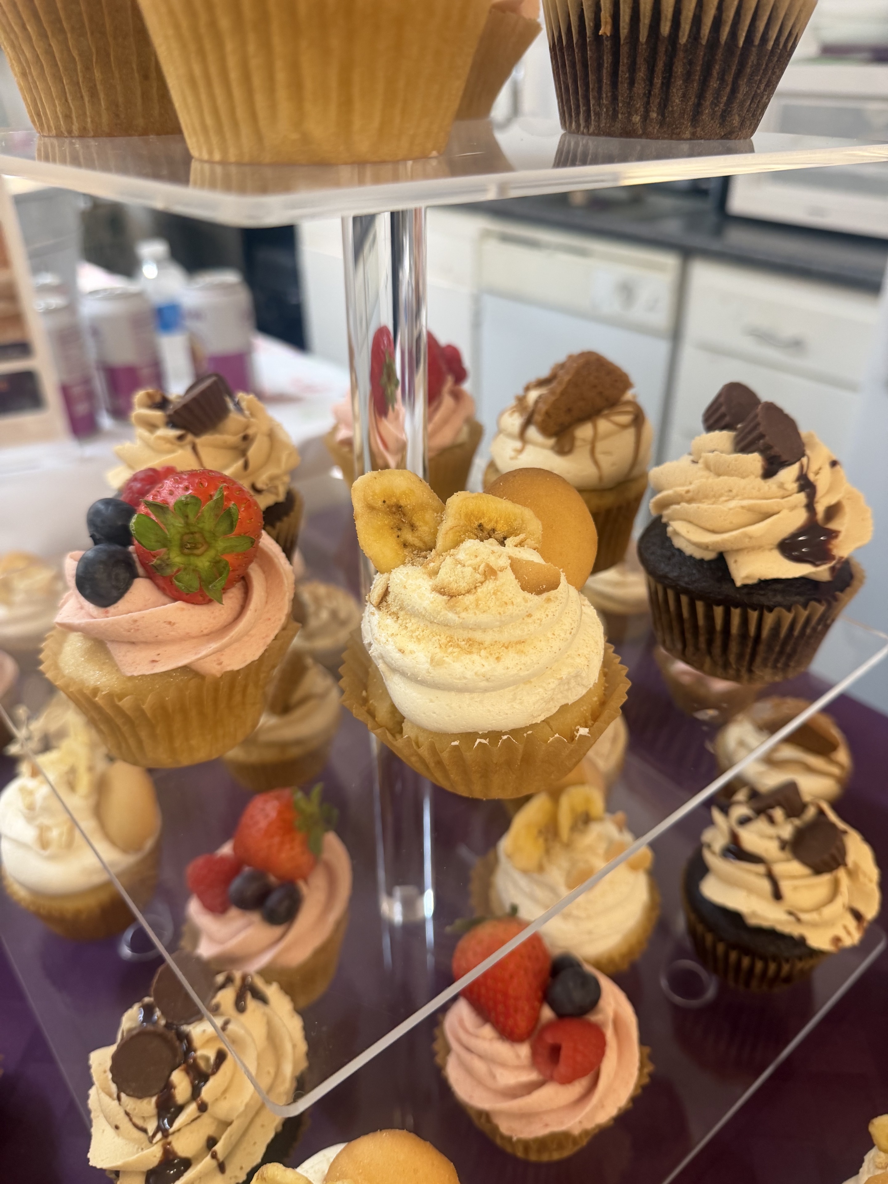 Assorted gourmet cupcakes on a tiered stand